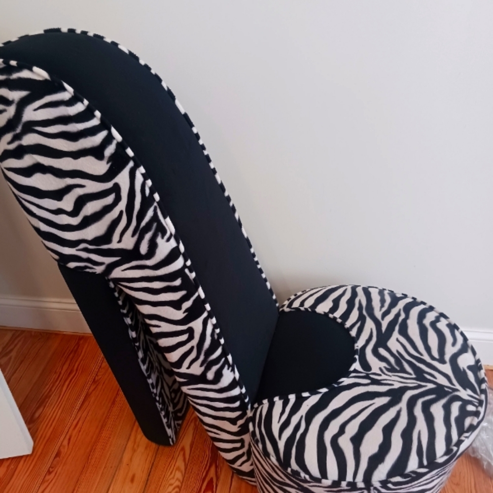 2 shoe chairs.  one black& white zebra printed. One pink with black